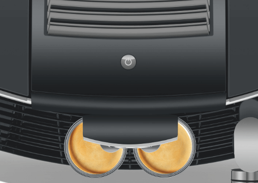 Widok z góry na 2 szklanki z kawą espresso stojące na obudowie ekspresu Jura